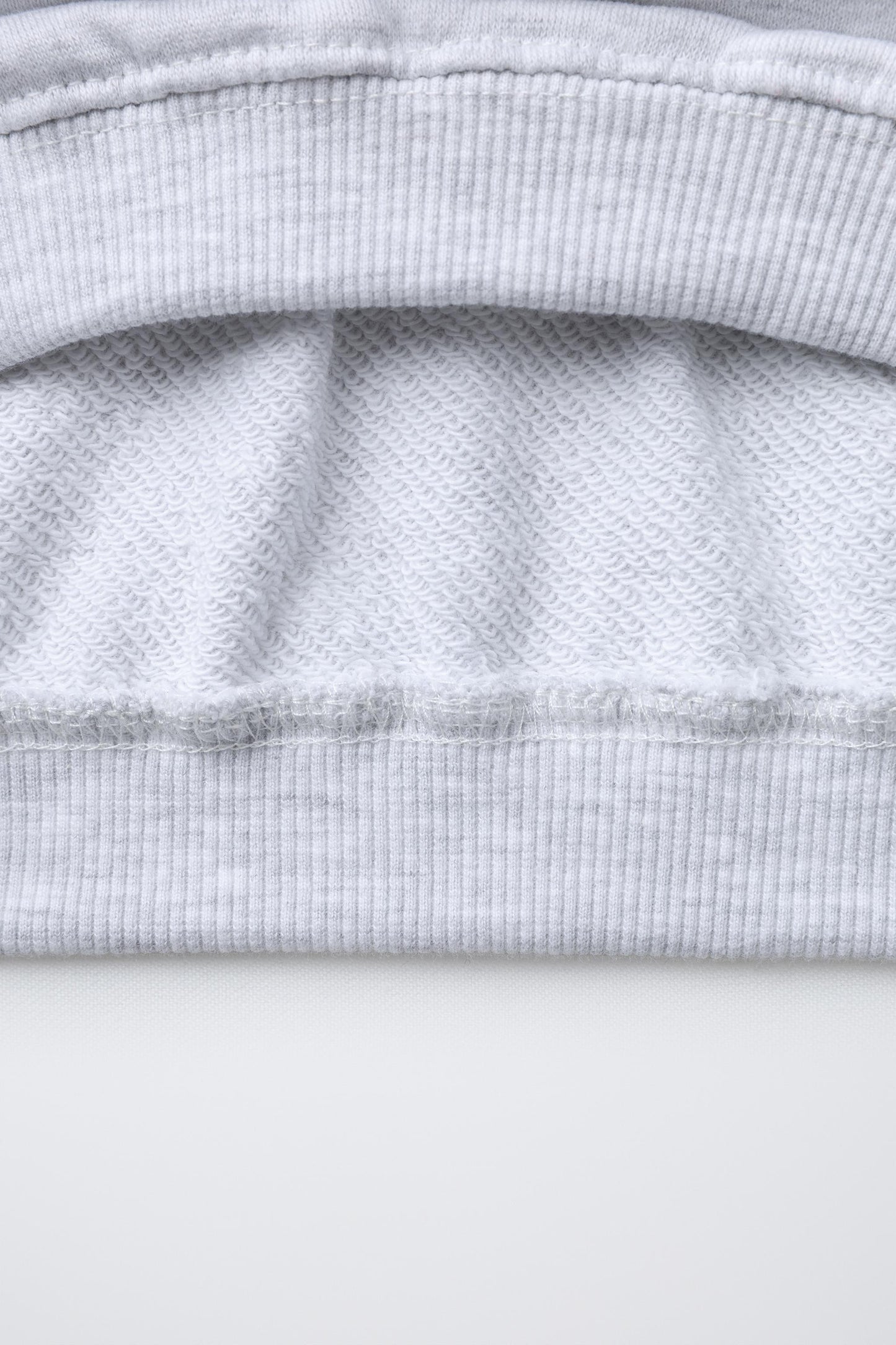 RAISED TEXT SWEATSHIRT