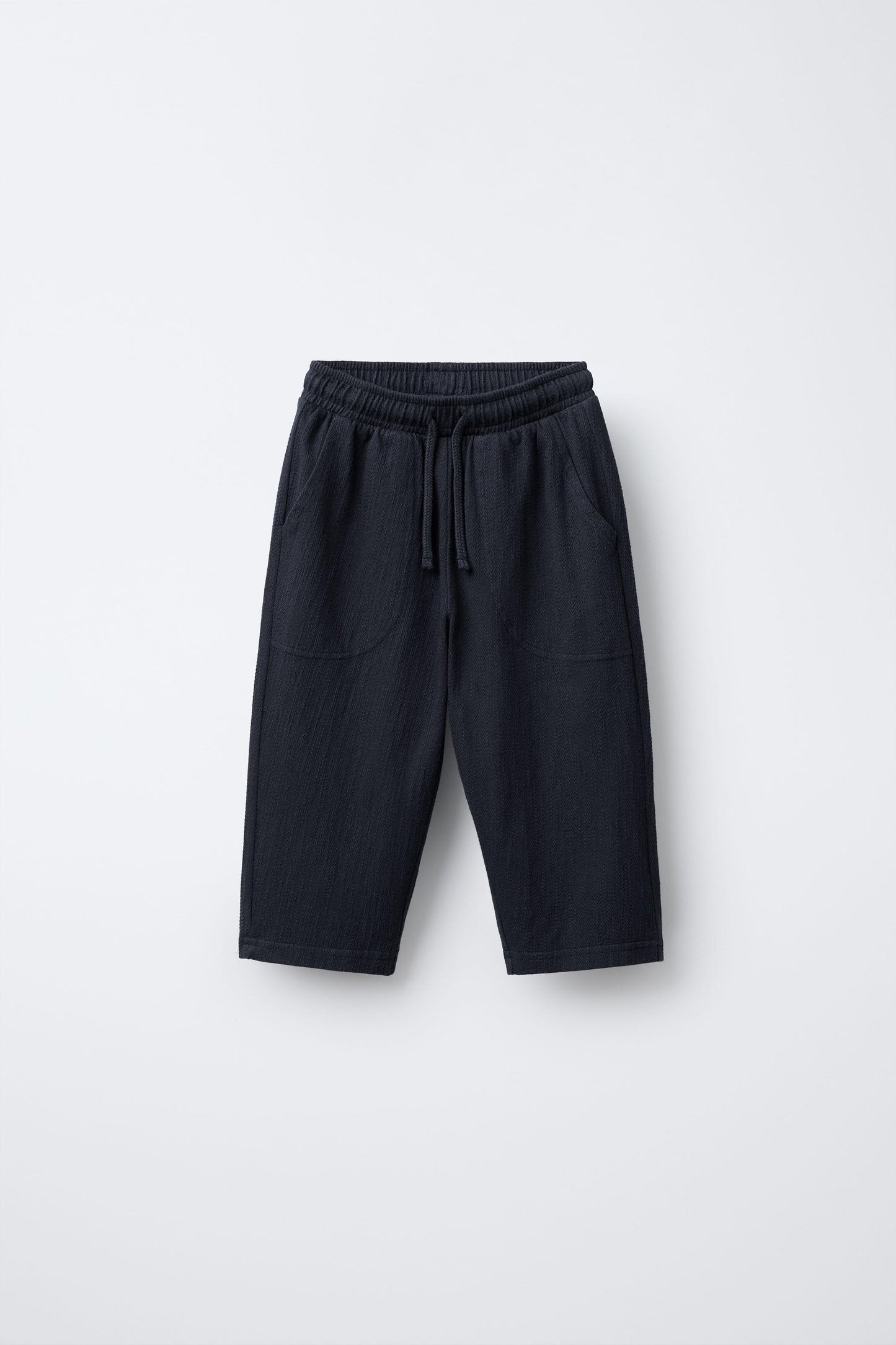 TEXTURED PANTS WITH LABEL
