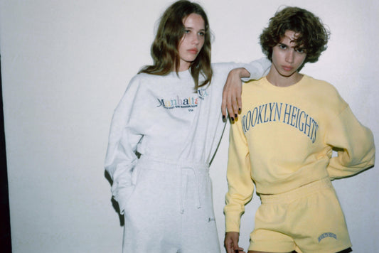 EMBROIDERED TEXT FLEECE SHORTS