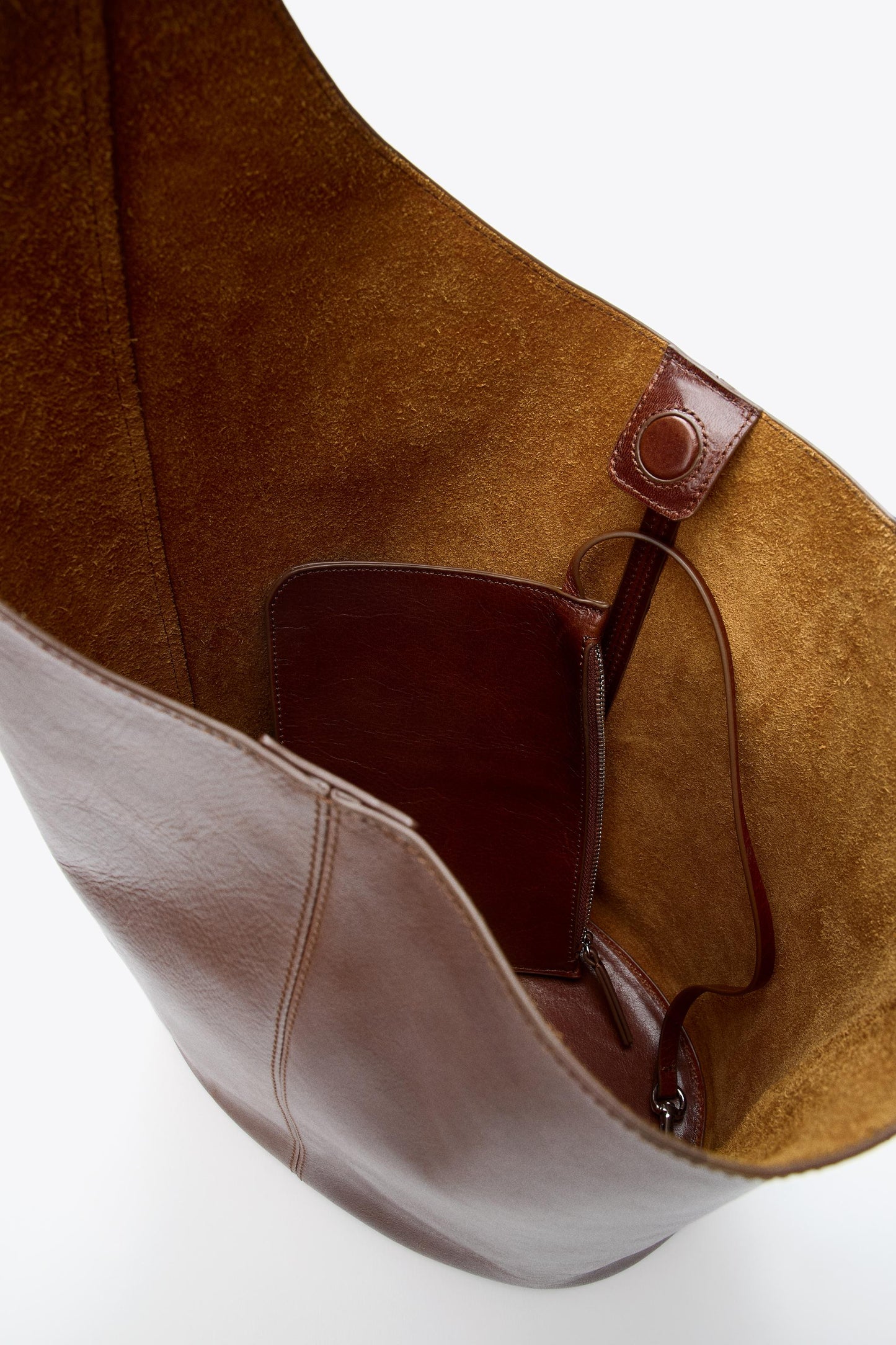 ASYMMETRIC LEATHER BUCKET BAG
