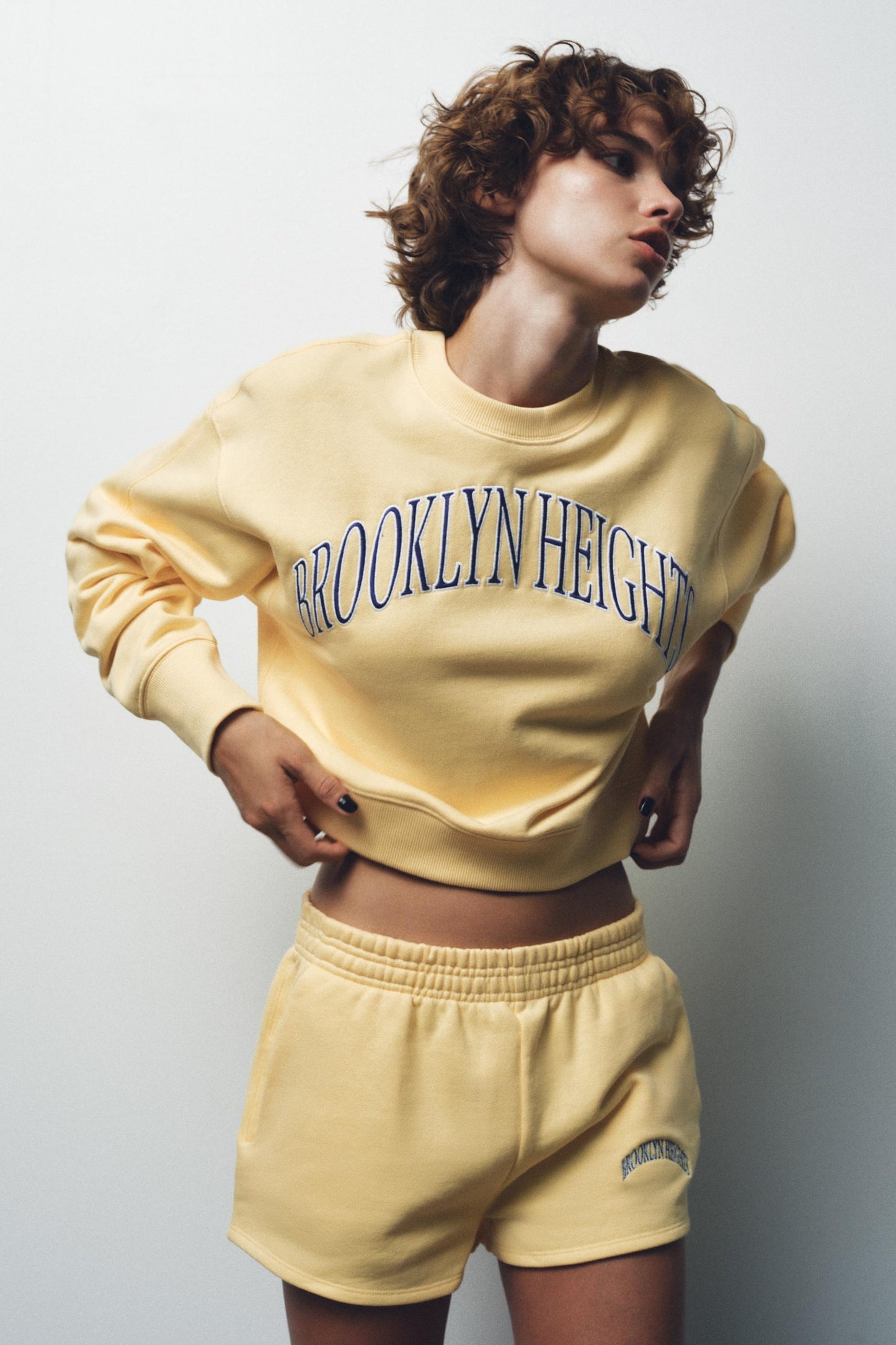 EMBROIDERED TEXT FLEECE SHORTS